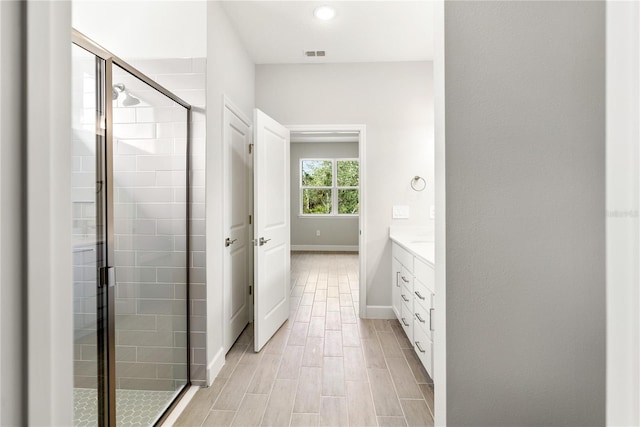 bathroom featuring vanity and walk in shower