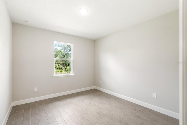 empty room with wood-type flooring