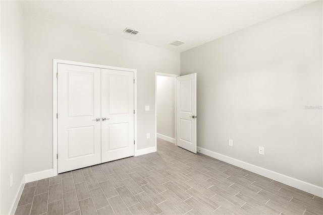 unfurnished bedroom with a closet