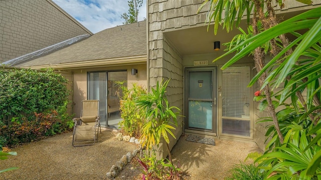 doorway to property with a patio area