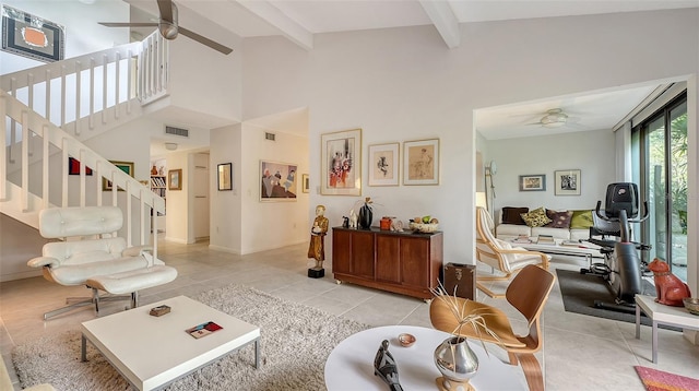 tiled living room with ceiling fan and beamed ceiling