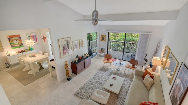 tiled living room with ceiling fan and high vaulted ceiling