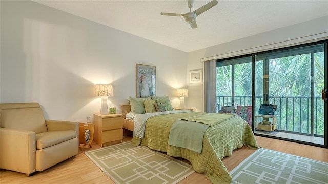 bedroom with ceiling fan, access to exterior, and wood-type flooring