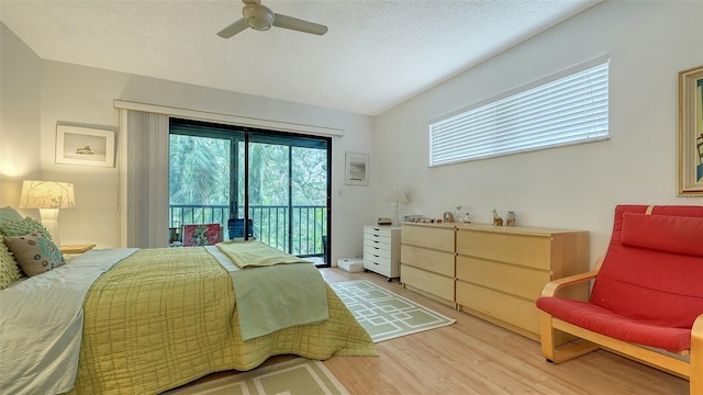 bedroom with ceiling fan, access to exterior, a textured ceiling, and light wood-type flooring