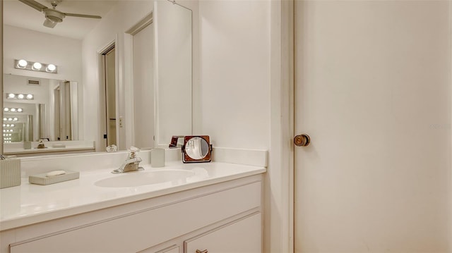 bathroom with ceiling fan and vanity