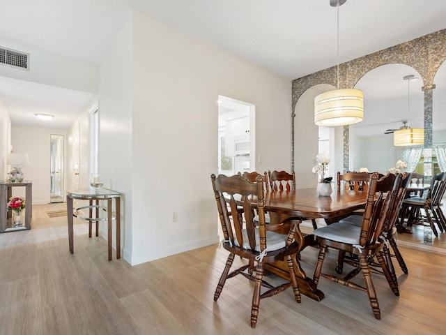 dining room featuring light hardwood / wood-style flooring and a wealth of natural light