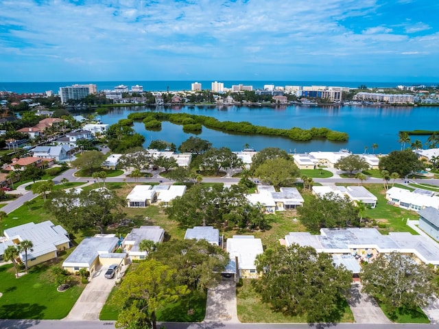 birds eye view of property with a water view