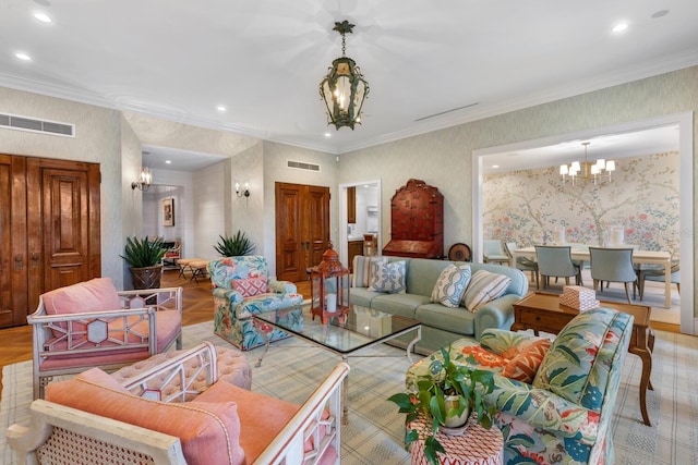 living room featuring light parquet flooring, a notable chandelier, and crown molding