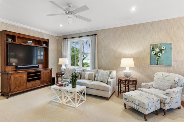 living room featuring ornamental molding, ceiling fan, and light colored carpet