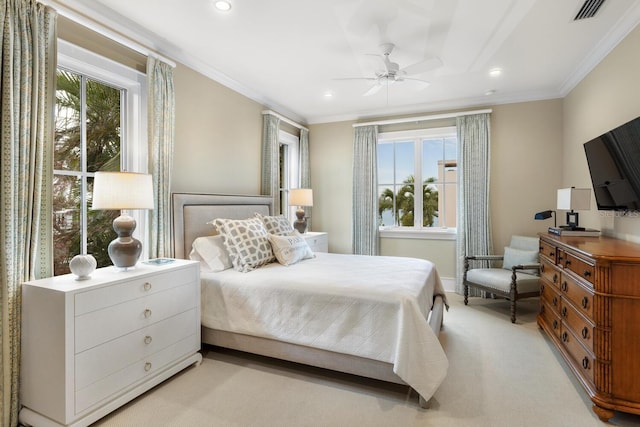 bedroom featuring ceiling fan, ornamental molding, and light carpet