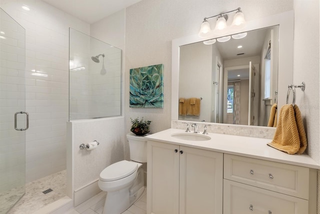 bathroom featuring walk in shower, vanity, and toilet