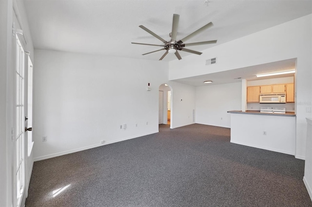 unfurnished living room with ceiling fan