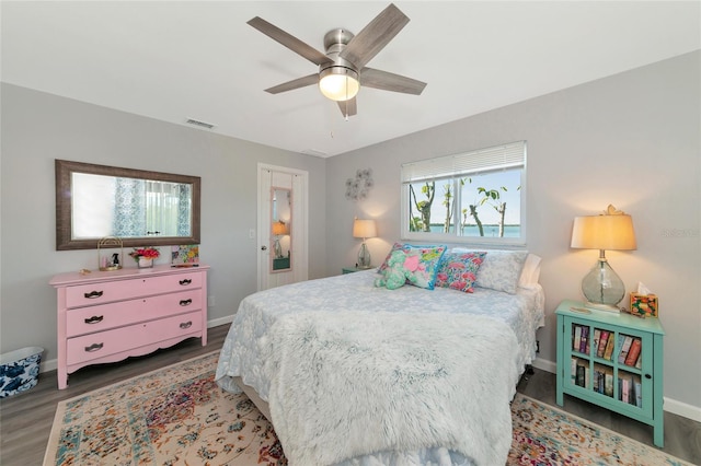 bedroom featuring dark wood-type flooring and ceiling fan