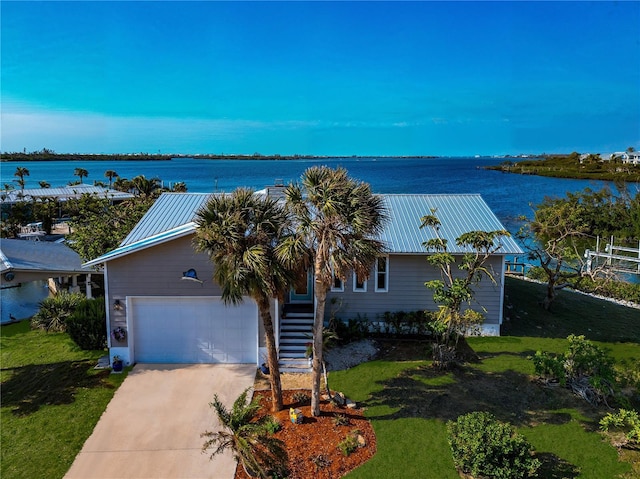 view of front of property with a water view and a front yard