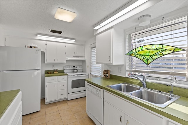 kitchen featuring a textured ceiling, white appliances, white cabinetry, and sink