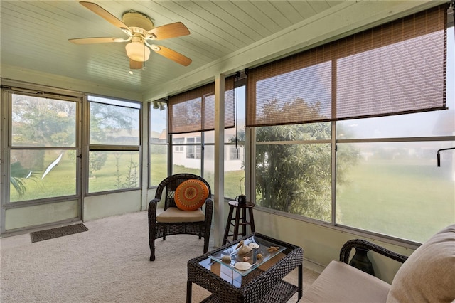 sunroom / solarium featuring ceiling fan