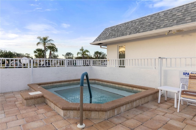 view of pool featuring a hot tub