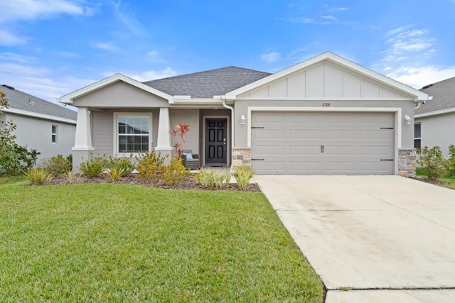 view of front of house featuring a garage and a front yard