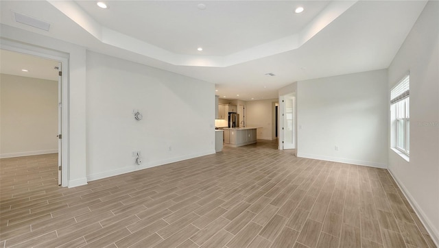 12649 Palatka Dr, Venice, FL 34293 - unfurnished living room featuring a tray ceiling