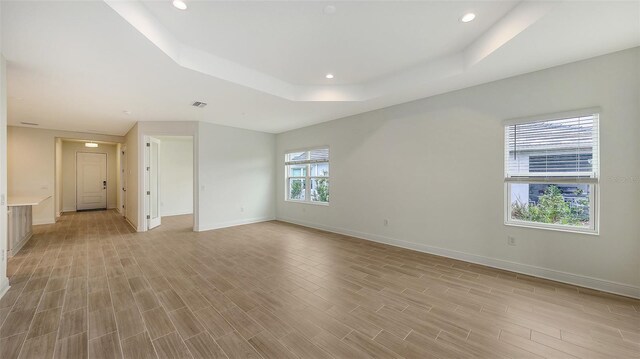 12649 Palatka Dr, Venice, FL 34293 - spare room featuring a tray ceiling