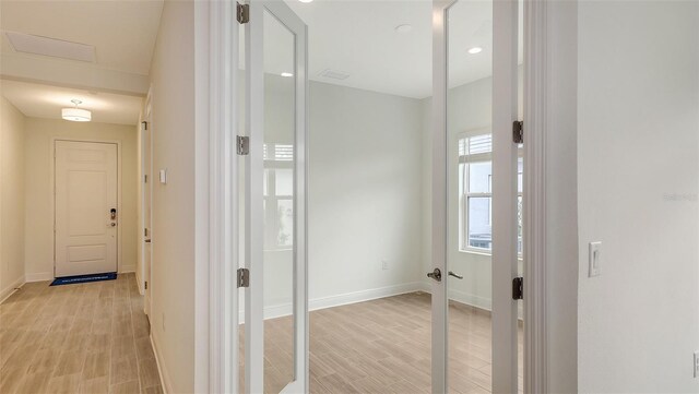 12649 Palatka Dr, Venice, FL 34293 - hallway with light hardwood / wood-style floors