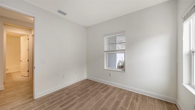 12649 Palatka Dr, Venice, FL 34293 - empty room featuring a healthy amount of sunlight