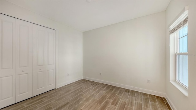 12649 Palatka Dr, Venice, FL 34293 - unfurnished bedroom with a closet and multiple windows