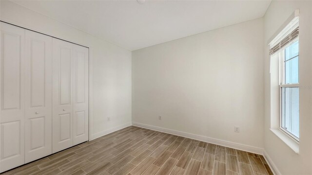12649 Palatka Dr, Venice, FL 34293 - unfurnished bedroom with a closet and multiple windows