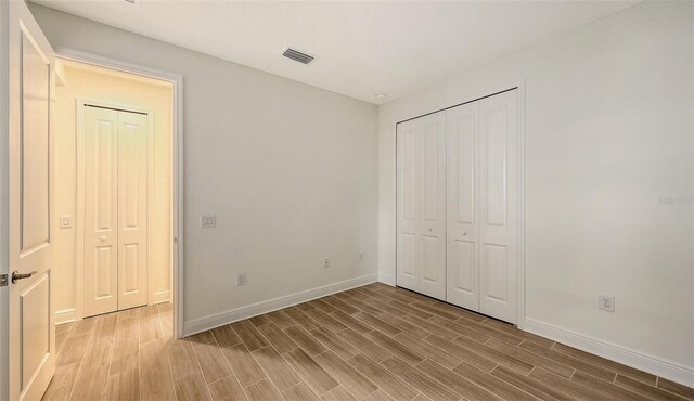 12649 Palatka Dr, Venice, FL 34293 - unfurnished bedroom with hardwood / wood-style floors and a closet