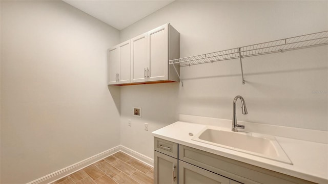12649 Palatka Dr, Venice, FL 34293 - washroom with washer hookup, cabinets, and sink
