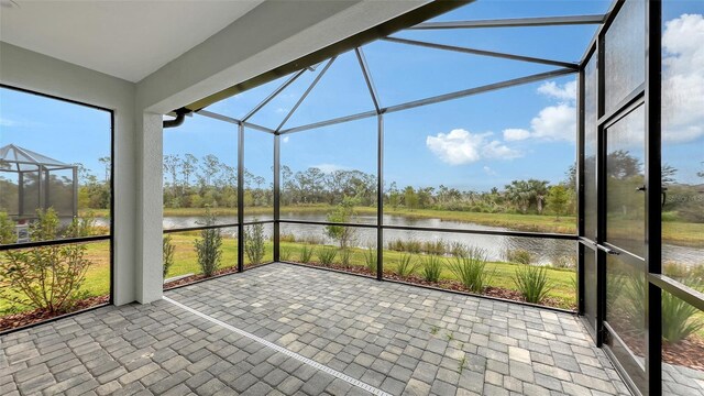 12649 Palatka Dr, Venice, FL 34293 - unfurnished sunroom with a water view