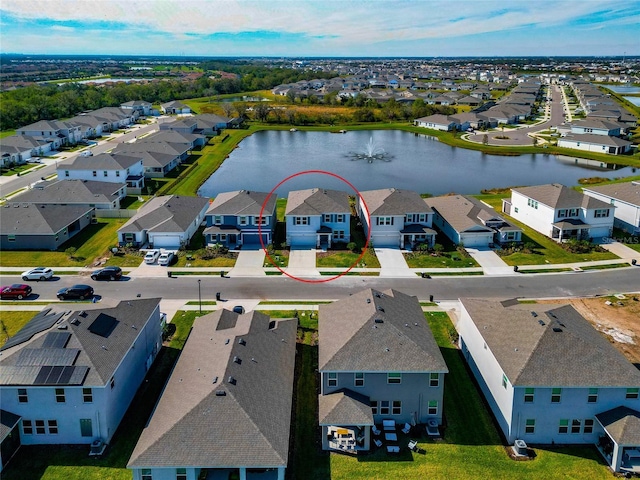 bird's eye view with a water view