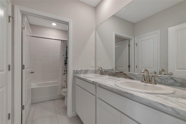 full bathroom featuring tile patterned flooring, vanity, toilet, and shower / bathtub combination with curtain