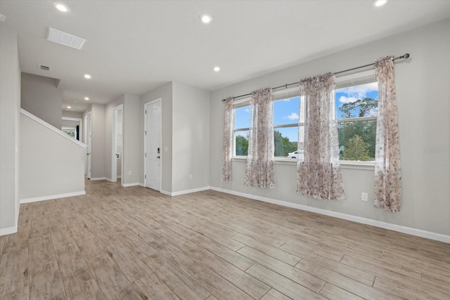 unfurnished room featuring light hardwood / wood-style floors