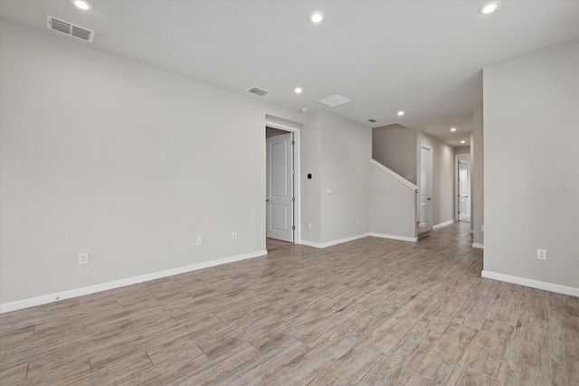 unfurnished room with light hardwood / wood-style floors