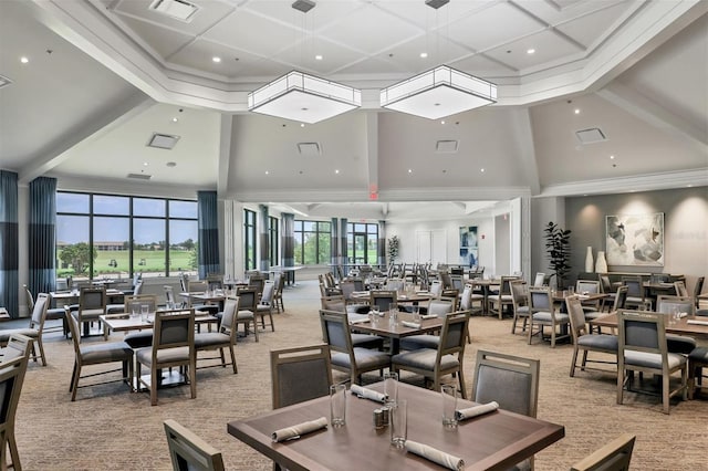 carpeted dining area with a towering ceiling