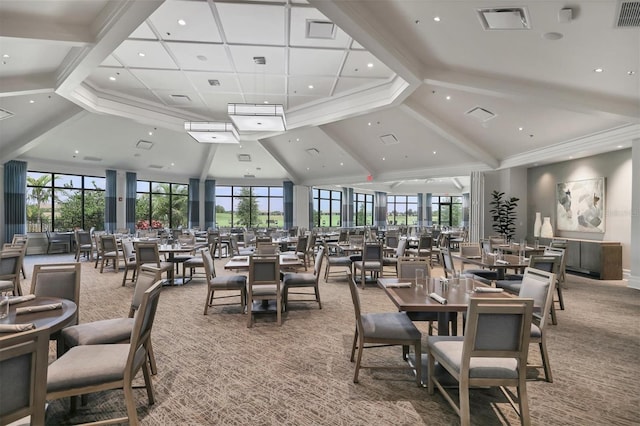 dining space featuring carpet and a high ceiling