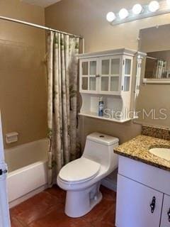 full bathroom featuring vanity, shower / tub combo, and toilet