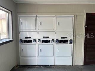 laundry room featuring stacked washer and dryer