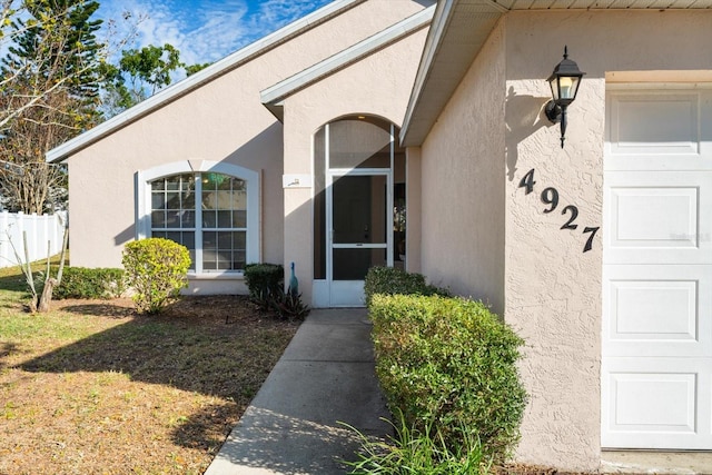 property entrance with a garage