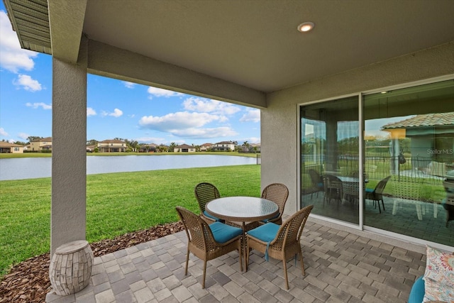 view of patio featuring a water view