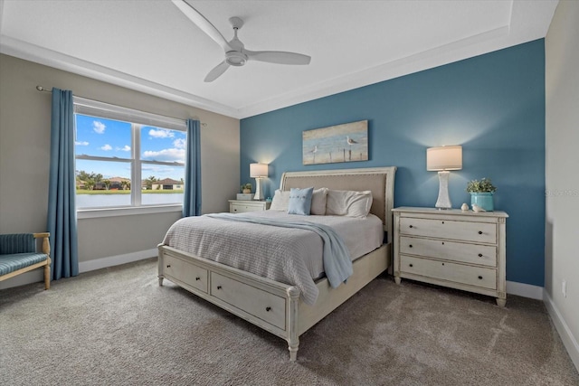 carpeted bedroom featuring ceiling fan and a water view