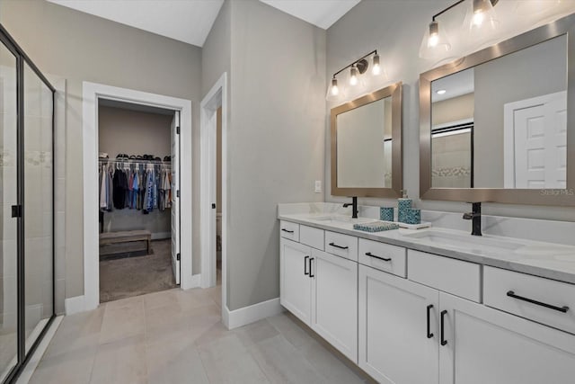 bathroom featuring tile patterned floors, vanity, and an enclosed shower