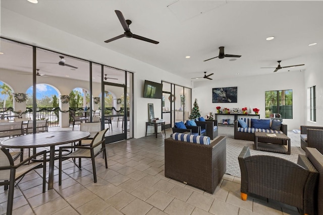 living room featuring plenty of natural light and light tile patterned flooring