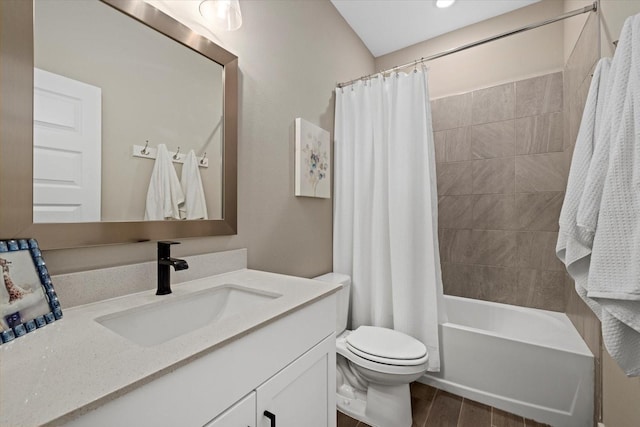 full bathroom with shower / tub combo, vanity, and toilet