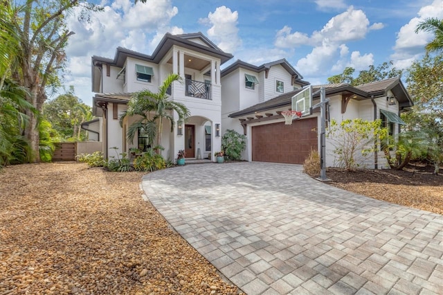 view of front of property with a balcony and a garage