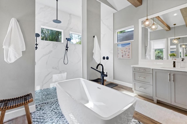 bathroom featuring shower with separate bathtub, vanity, hardwood / wood-style flooring, and vaulted ceiling with beams