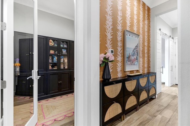 hallway featuring a barn door