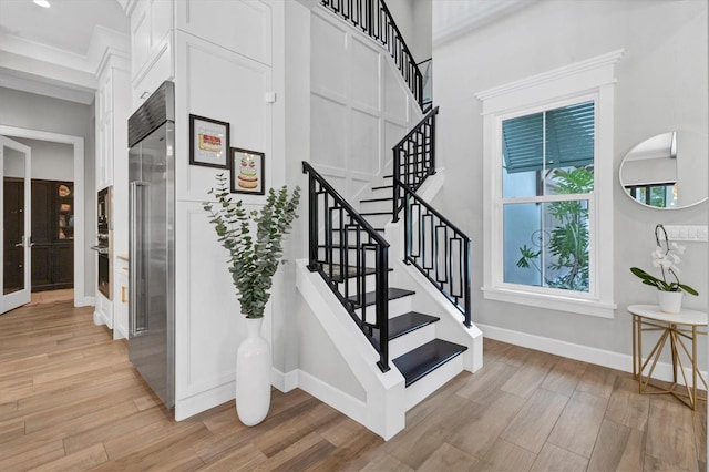 staircase with ornamental molding