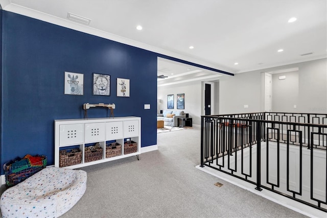 corridor with crown molding and carpet